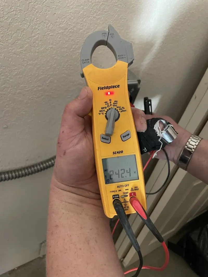 Voltage testing with clamp meter during Recessed Lighting Installation in Fairfield